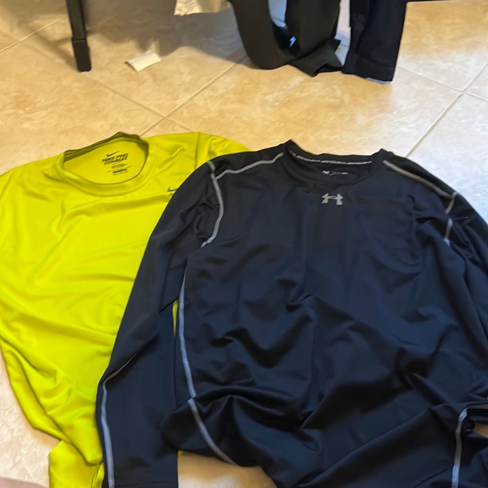 HARDLY WORN UNDER ARMOR AND NIKE SHIRT